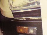 a picture of a close up of a car ' s headlight