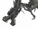 a statue of a dragon that is sitting on a table