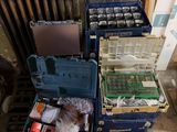 many different types of tools sitting on a pallet next to a radiator