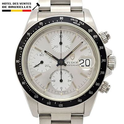 Montre Rolex avec cadran blanc et lunette noire