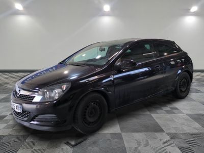 a picture of a black car parked on a checkered floor
