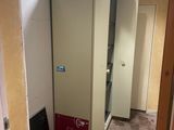 a refrigerator in the middle of a room with a chalk board on the floor