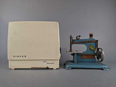 a small toy sewing machine and a small sewing machine