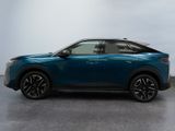 a blue suv parked in a room with a white wall