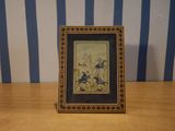 a picture of a picture on a table with a blue and white striped background