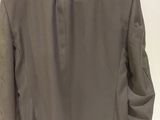 the back of a gray jacket on a mannequin mannequin mannequin mannequin mannequin mannequin mannequin mannequin