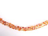 collier composé de perles de verre orange, avec un fermoir plaqué or