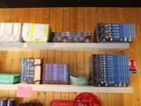 many boxes and boxes on the shelves in the room