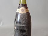 a bottle of wine that is sitting on a table