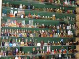 many bottles of liquor on the shelves in the room