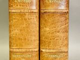 an old pair of books sitting on top of each other
