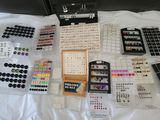 a lot of buttons and buttons on a bed