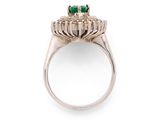 a close up of a ring with a green stone in it