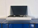 an image of a turn table with a record player on it