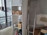 a ladder leaning against a wall in a garage