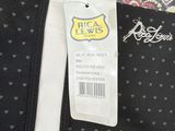 a black bag with hearts on it and a price tag on it