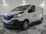 the white van is parked on a checkered floor in a room