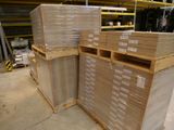 many stacks of boxes stacked on top of each other