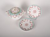 three pieces of tea set on a white table