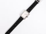 an image of a wrist watch with a black strap on a white surface