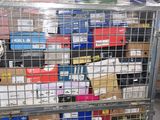 a metal cage filled with boxes and boxes in a warehouse