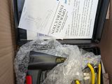 a box with tools inside of it on a table