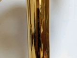 a close up of a gold umbrella on a table