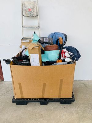 a cardboard box full of items in a garage