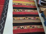 two rugs that are on a table in a room