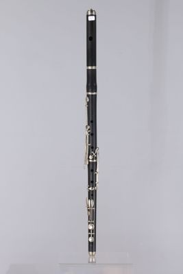 a black and silver clarinet sitting on top of a white table