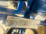 a close up of a blue bicycle with a label on it