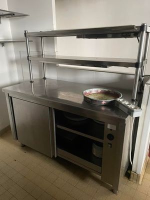 a stainless steel counter with a bowl on top of it