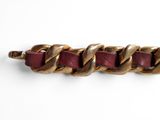 gold and burgundy leather bracelet with a chain link