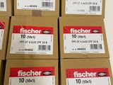 a stack of boxes of fischer tape on a shelf