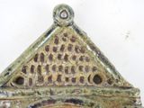 a close up of a decorative object on a white surface
