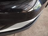 a close up of a car ' s front bumper