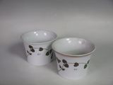 two cups that are sitting next to each other on a table