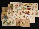 many cards with flowers and birds on them on a table
