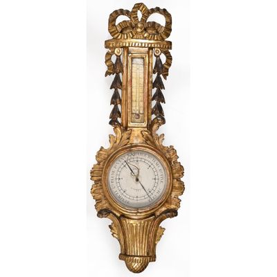 an old fashioned clock with a gold frame and ornate decoration
