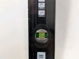 a black box with a green tape on it