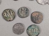 a lot of coins that are on the table