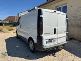a white van that is parked in front of a house