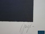 a close up of a piece of paper with a black square on it
