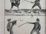 un vieux livre sur lequel figure l'image de deux hommes se battant à l'épée