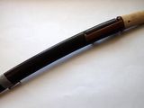 a baseball bat that is laying on a table