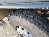 a close up of a tire on a truck