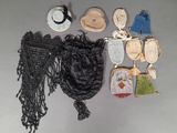 a lot of purses and hats on a table