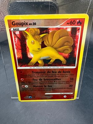a close up of a pokemon card in a plastic case