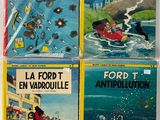 four books in french are on a white surface