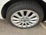 a white car that has a flat tire on it